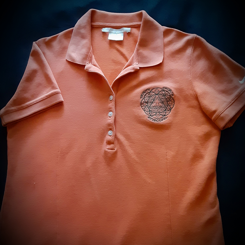 promotional orange polo shirt embroidered with logo