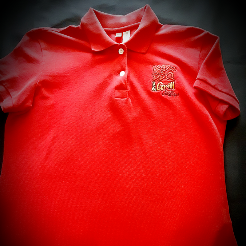 promotional red polo t-shirt for VooDoo BBQ and Grill