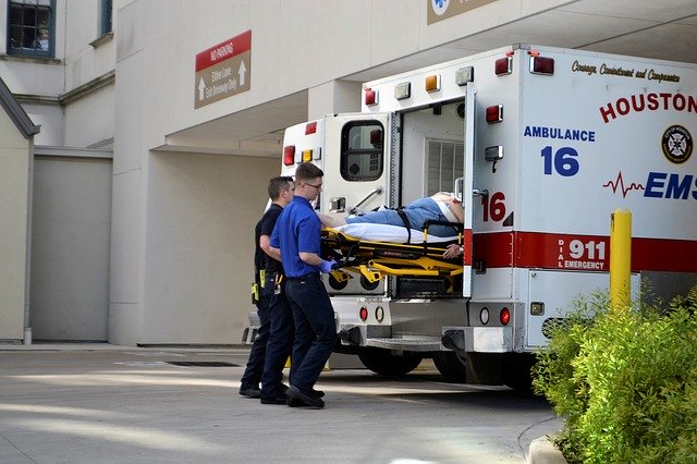 First Responders loading a patient into an ambulance