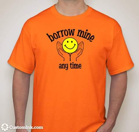 orange T-shirt with borrow mine (smily face) any time